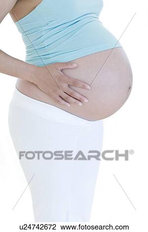 Pregnant woman's abdomen View Large Photo Image Stock Image - Pregnant woman's abdomen. Fotosearch