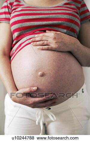 Pregnant woman's abdomen View Large Photo Image Stock Photo - Pregnant woman's abdomen. Fotosearch