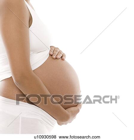 Stock Photo - Pregnant woman's abdomen. Fotosearch