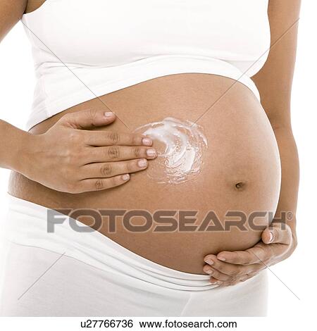 Pregnant woman's abdomen View Large Photo Image Stock Photograph - Pregnant woman's abdomen. Fotosearch