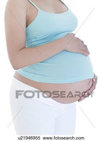 Pregnant woman's abdomen View Large Photo Image Stock Photography - Pregnant woman's abdomen. Fotosearch