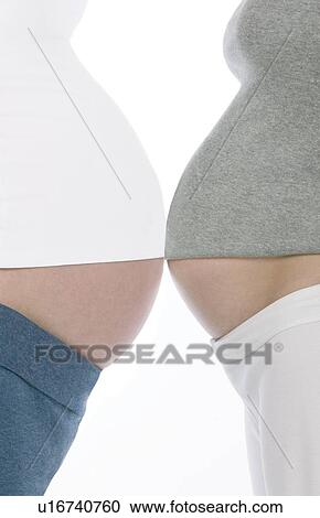 Pregnant women's abdomens View Large Photo Image Stock Image - Pregnant women's abdomens. Fotosearch