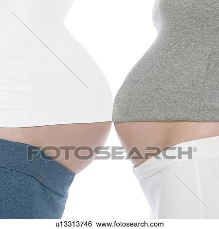 Pregnant women's abdomens View Large Photo Image Stock Photograph - Pregnant women's abdomens. Fotosearch