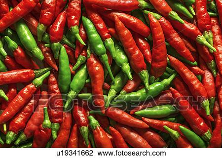 Stock Image - Red and green chilli peppers. Fotosearch
