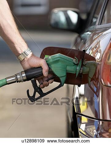 Refuelling car View Large Photo Image Stock Photo - Refuelling car. Fotosearch