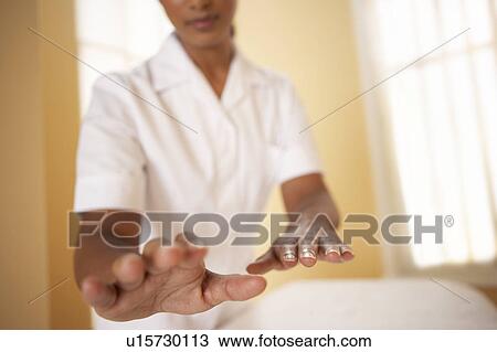 Stock Image - Reiki healing. Fotosearch