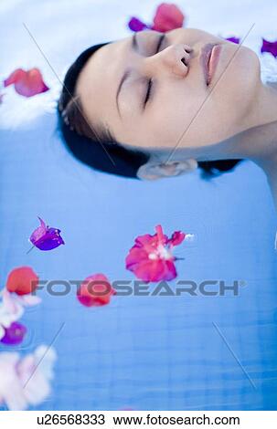Stock Image - Relaxed woman on holiday. Fotosearch