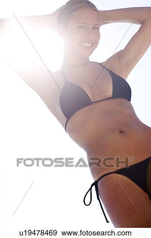Stock Photo - Relaxed woman on holiday. Fotosearch