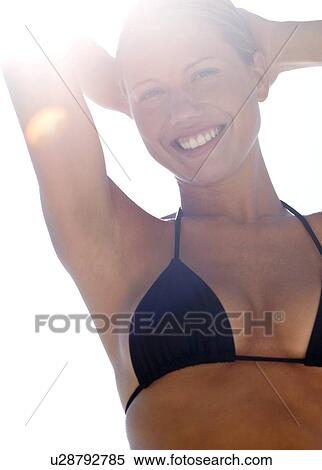 Stock Photography - Relaxed woman on holiday. Fotosearch