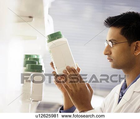 Stock Image - Researcher in a laboratory. Fotosearch