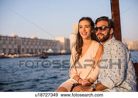Romantic couple on boat at Dubai marina, United Arab Emirates View Large Photo Image Stock Photo - Romantic couple on boat at Dubai marina, United Arab Emirates. Fotosearch