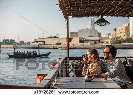 Romantic couple photographing from Dubai marina cafe, United Arab Emirates View Large Photo Image Stock Image - Romantic couple photographing from Dubai marina cafe, United Arab Emirates. Fotosearch