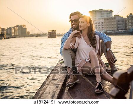 Romantic couple sitting on boat at Dubai marina, United Arab Emirates View Large Photo Image Stock Image - Romantic couple sitting on boat at Dubai marina, United Arab Emirates. Fotosearch