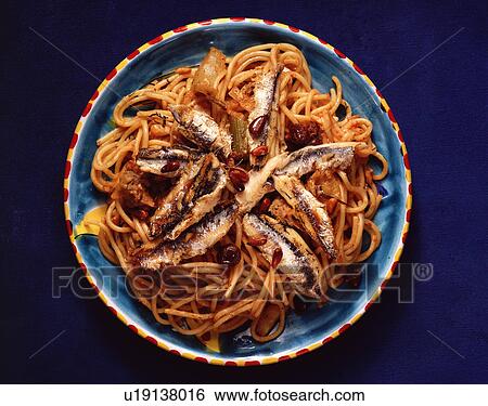 Sardines with spaghetti in bowl, overhead view View Large Photo Image Stock Photograph - Sardines with spaghetti in bowl, overhead view. Fotosearch