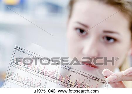 Scientist holding dna sequencing results View Large Photo Image Stock Image - Scientist holding dna sequencing results. Fotosearch