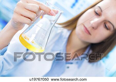 Scientist testing egg yolk in a lab View Large Photo Image Stock Image - Scientist testing egg yolk in a lab. Fotosearch
