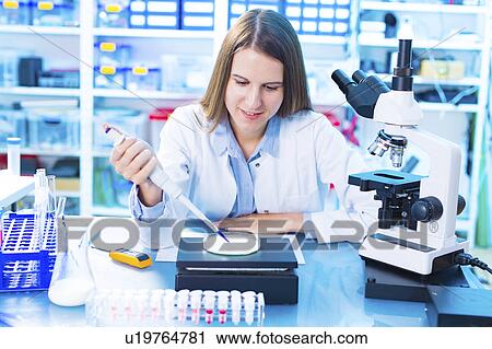 Scientist testing milk sample View Large Photo Image Stock Image - Scientist testing milk sample. Fotosearch