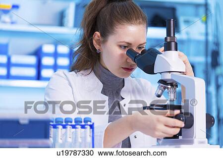 Scientist using microscope View Large Photo Image Stock Image - Scientist using microscope. Fotosearch