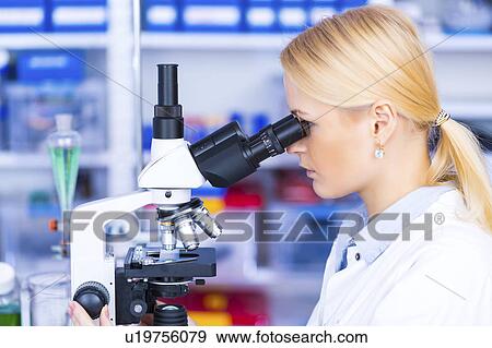 Scientist using microscope View Large Photo Image Stock Photo - Scientist using microscope. Fotosearch