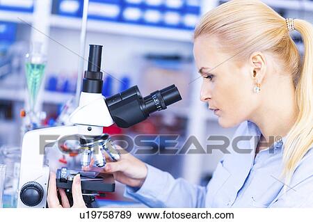 Scientist using microscope View Large Photo Image Stock Photo - Scientist using microscope. Fotosearch