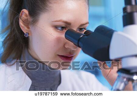 Scientist using microscope View Large Photo Image Stock Photo - Scientist using microscope. Fotosearch