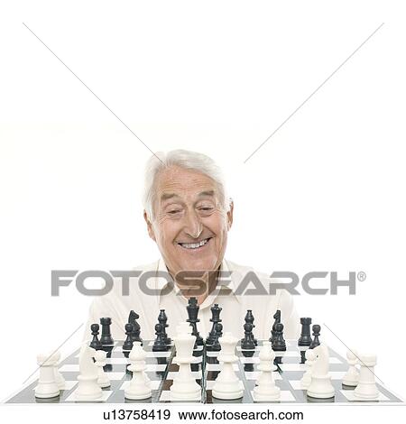 Senior man playing chess View Large Photo Image Stock Photo - Senior man playing chess. Fotosearch