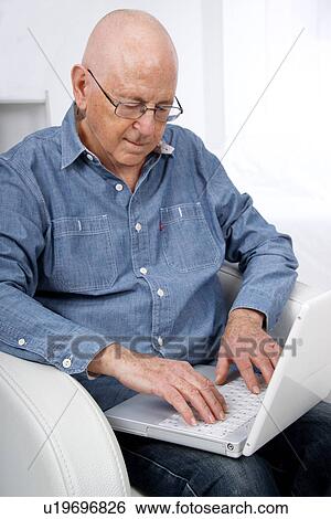Senior man using laptop View Large Photo Image Stock Photograph - Senior man using laptop. Fotosearch