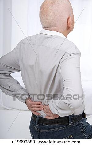 Stock Image - Senior man with backache. Fotosearch