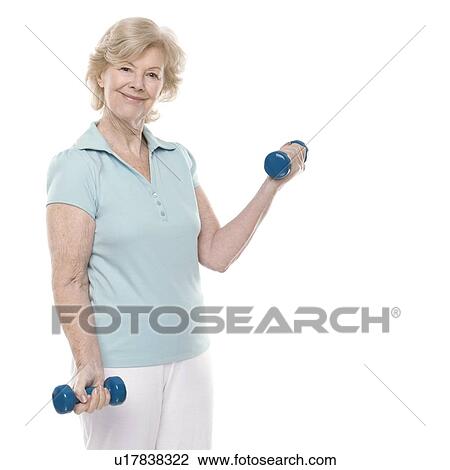 Stock Image - Senior woman lifting weights. Fotosearch