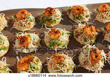 Sesame noodles and chilli prawn canapes View Large Photo Image Picture - Sesame noodles and chilli prawn canapes. Fotosearch