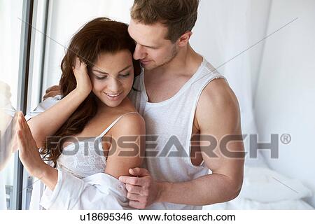 Sexy young woman and boyfriend at bedroom window View Large Photo Image Stock Photograph - Sexy young woman and boyfriend at bedroom window. Fotosearch