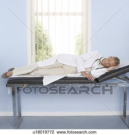 Stock Image - Sleeping doctor. Fotosearch