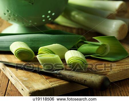 Sliced leeks on chopping board, close-up View Large Photo Image Stock Photograph - Sliced leeks on chopping board, close-up. Fotosearch