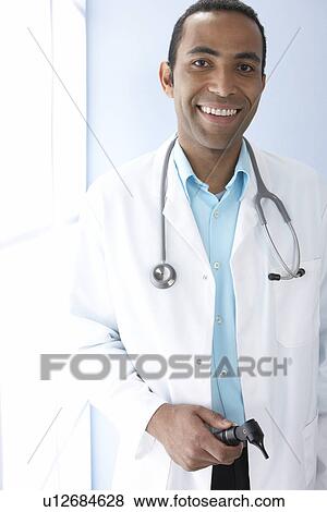 Smiling doctor View Large Photo Image Stock Photo - Smiling doctor. Fotosearch