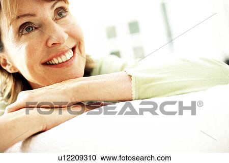 Stock Image - Smiling woman. Fotosearch