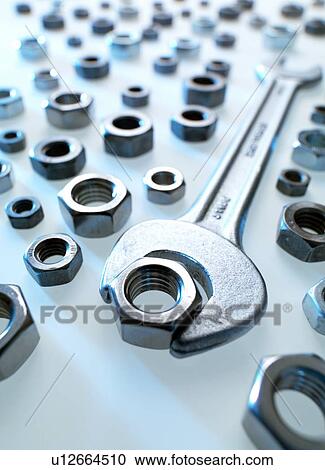 Stock Image - Spanner and nuts. Fotosearch