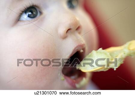 Stock Image - Spoon-feeding. Fotosearch