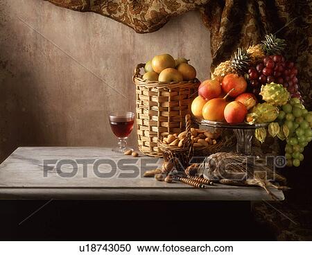 Stock Image - Still life of grouse, fruit, nuts and wine. Fotosearch