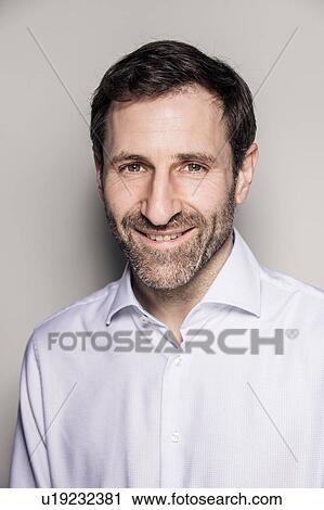Studio portrait of confident bearded businessman View Large Photo Image Stock Image - Studio portrait of confident bearded businessman. Fotosearch
