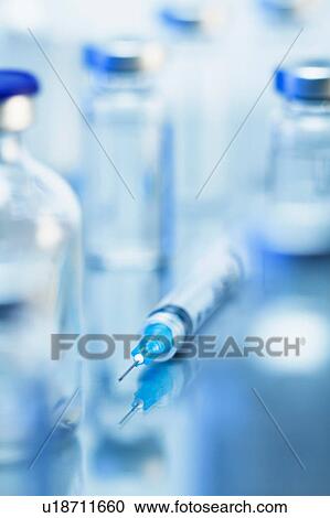 Syringe. Disposable plastic medical syringe surrounded by sealed medication vials View Large Photo Image Stock Image - Syringe. Disposable plastic medical syringe surrounded by sealed medication vials. Fotosearch