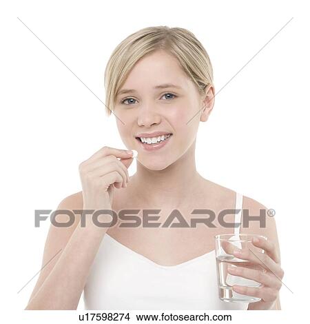 Picture - Taking a pill. Fotosearch