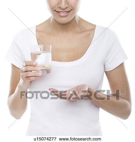 Stock Photo - Taking a tablet. Fotosearch