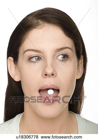 Stock Photo - Taking a tablet. Fotosearch