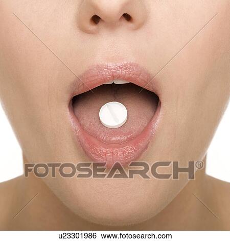 Taking a tablet View Large Photo Image Stock Photograph - Taking a tablet. Fotosearch