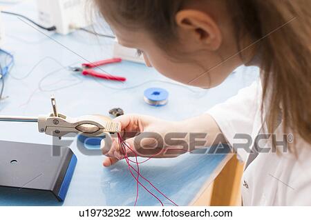 Technician assembling a sensor View Large Photo Image Stock Image - Technician assembling a sensor. Fotosearch