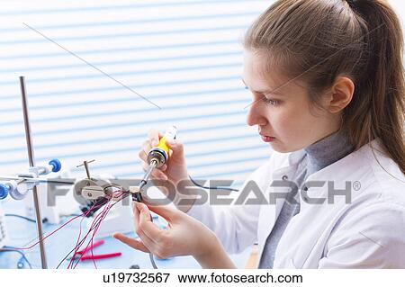 Technician soldering wires in lab View Large Photo Image Stock Photo - Technician soldering wires in lab. Fotosearch