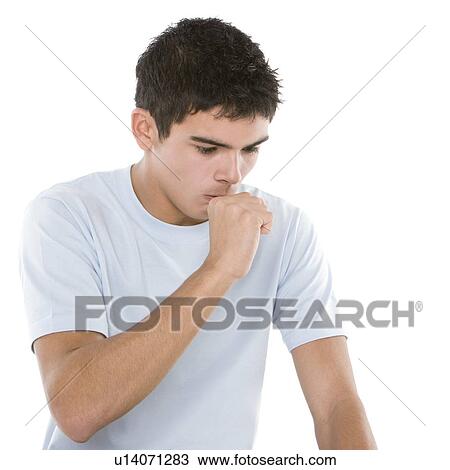 Stock Image - Teenage boy coughing. Fotosearch