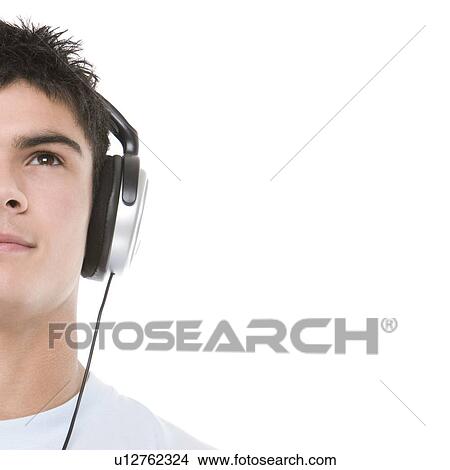 Teenage boy listening to music View Large Photo Image Picture - Teenage boy listening to music. Fotosearch