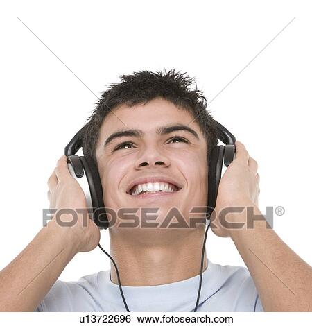 Stock Photograph - Teenage boy listening to music. Fotosearch
