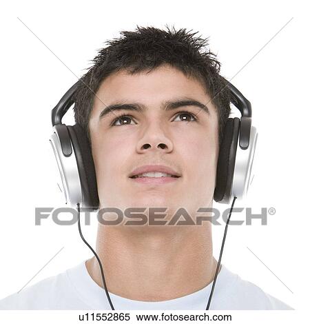 Teenage boy listening to music View Large Photo Image Stock Photography - Teenage boy listening to music. Fotosearch